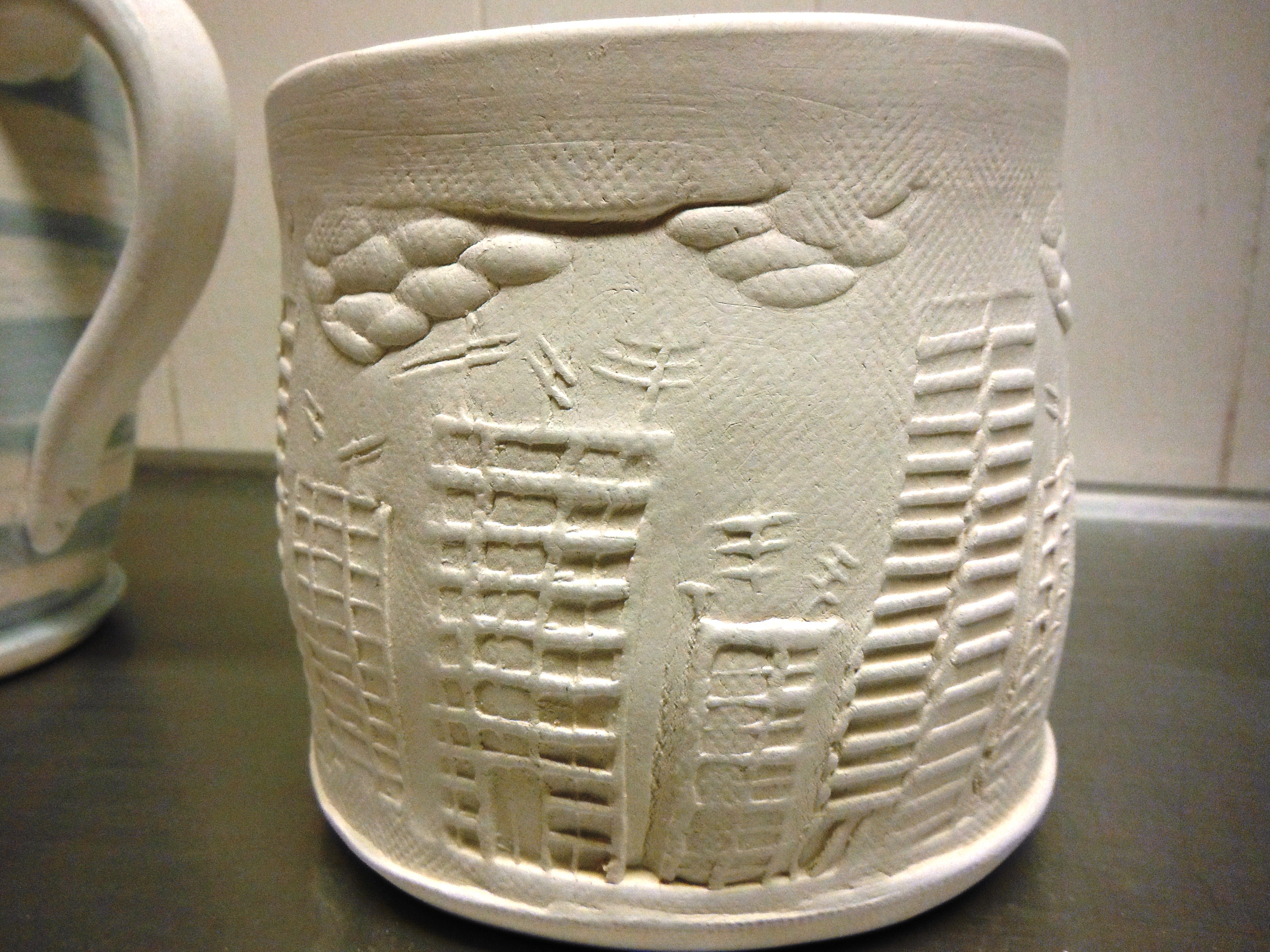 Make 21: I carved a cityscape rolling stamp, and tried it out here. 